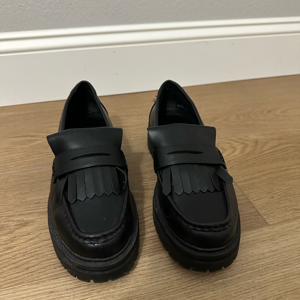 Black Leather Loafers with Fringe Detail
